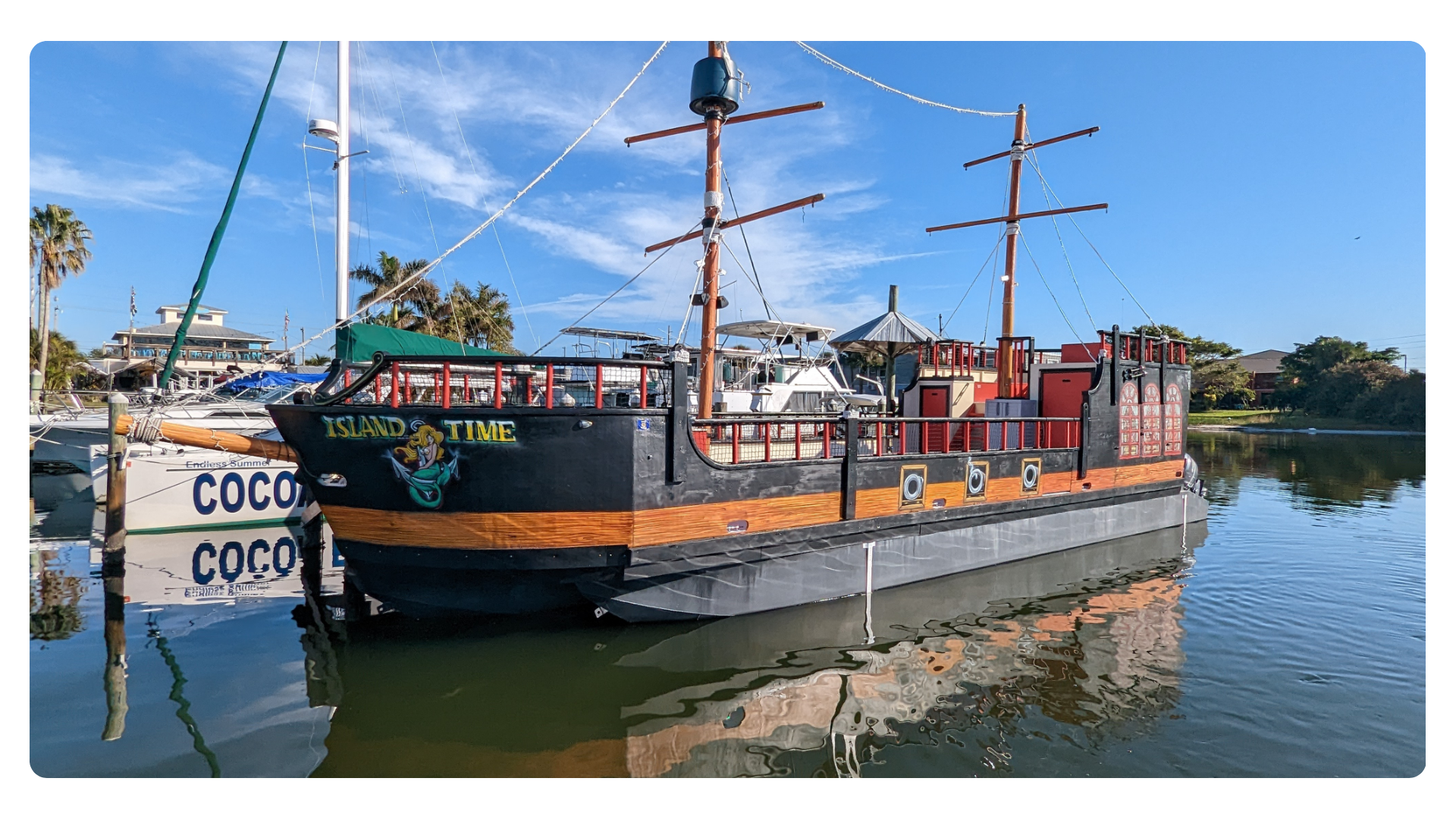 a boat is docked next to a body of water